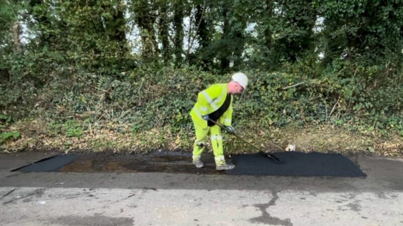 Devon Highways team patching a road