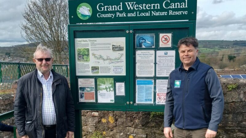 Ray Alexander (IWA) and Mark Baker (Grand Western Canal Country Park Manager) beside one of the new noticeboards