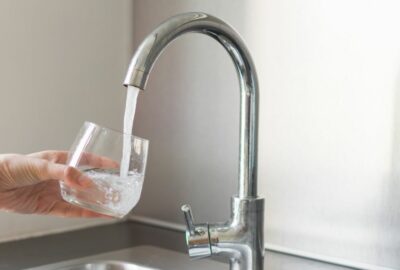 Filling a glass of water from the tap