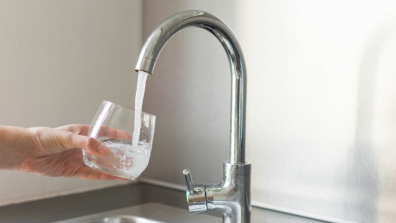 Filling a glass of water from the tap