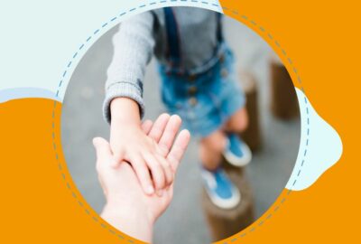 Adult extending hand to child