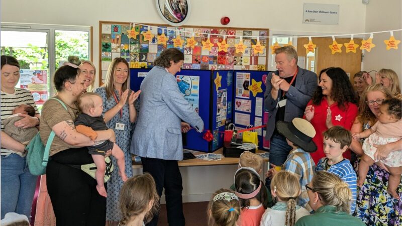 A group of parents and young children at a Family Hub, with Councillor Andrew Leadbetter