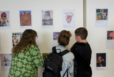 Jo Siney at art exhibition with children