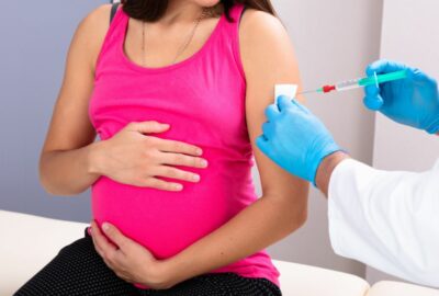 A pregnant woman having a vaccination
