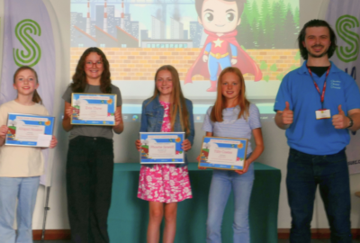 Competition winners with their prizes