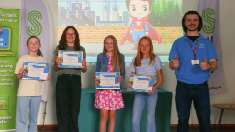 Competition winners with their prizes