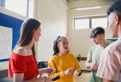Young people talking at a youth club