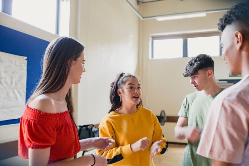 Young people talking at a youth club