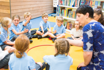 Children sat in a circle in a classroom