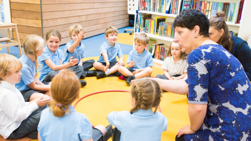 Children sat in a circle in a classroom
