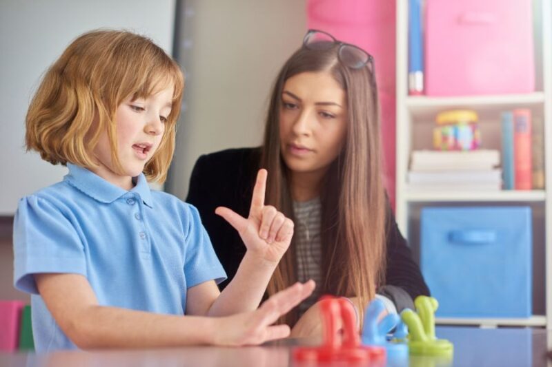 Teacher working 1:1 with child