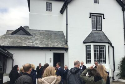 The old council building in Tavistock, with invited guests stood outside it