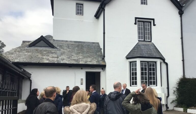 The old council building in Tavistock, with invited guests stood outside it
