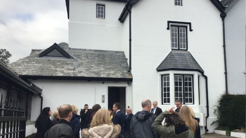 The old council building in Tavistock, with invited guests stood outside it