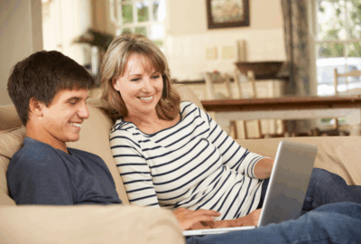 Mother and son on laptop