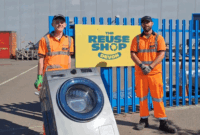 Two SUEZ staff with a washing machine