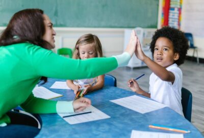 Teacher in classroom with pupils