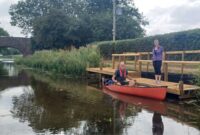 Canal Ranger Craig Saunderson and Minnows Touring Park Owner Julie Evans at the new landing stage beside Holbrook Bridge