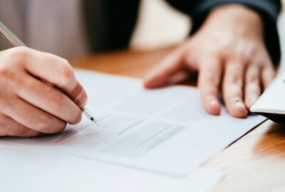 A person completing a written form