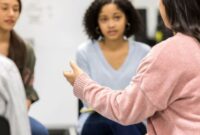 Three people talking in a group