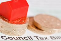 image shows a small house (like a 'Monopoly' house) on the top of a pile of pound coins, on top of a council tax bill.