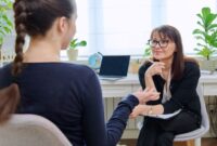 An Educational Psychologist talking to young person in an office