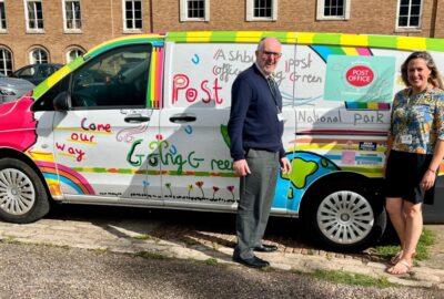 Councillor Cottle-Hunkin (right) and Cllr Rogers (left) standing in front of Cllr Rogers mobile post office van, parked at County Hall, Exeter.