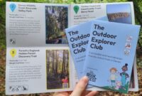 Two hands holding the outdoor explorers book leaflet