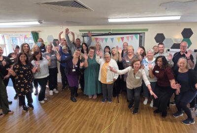 A group photo of Kinship Carers enjoying the celebration event