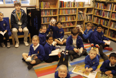 Children in the library at The Beacon Primary School in Exmouth