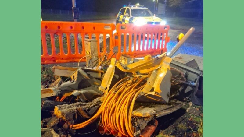Police car near damaged traffic lights