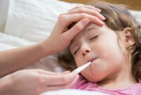 A young child, unwell, lying in bed and her parent is taking her temperature with a thermometer in their mouth