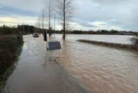 A flooded road and pavement near Exeter