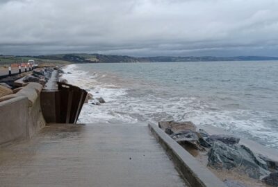 Waves crashing into the damaged sea defence at Torcross following Storm Ingrid
