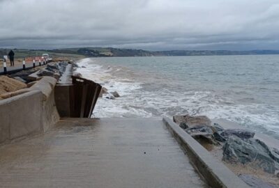 Waves crashing in to the sea defence at Torcross, following Storm Ingrid
