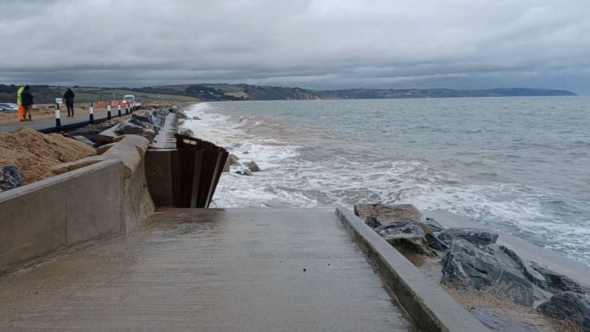 Waves crashing in to the sea defence at Torcross, following Storm Ingrid