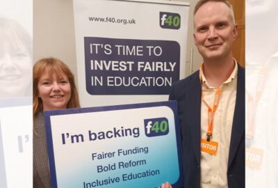 Councillor Denise Bickley and Councillor Richard Jefferies holding a poster that says we're backing the f40 campaign for fairer funding