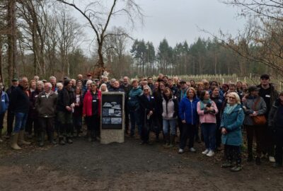 Guests unveil a plinth to commorate the end of the restoration project at Stover Country Park