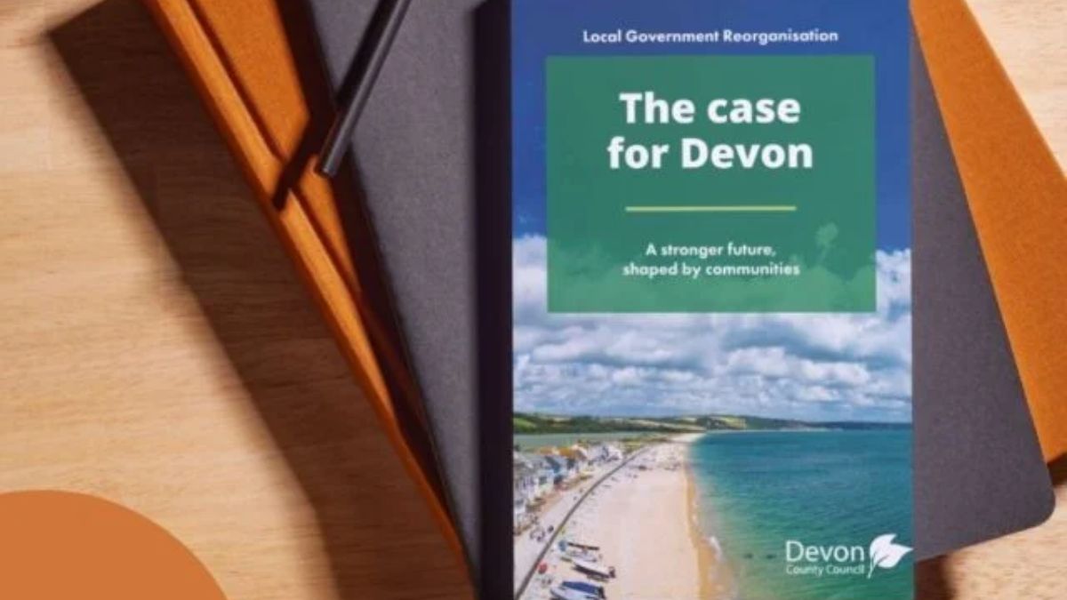 The LGR document entitled The Case For Devon. The document is resting on the top of a pile of books and folders