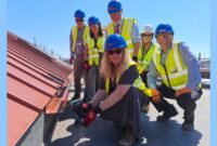The Chair of Devon County Council, Councillor Caroline Leaver (front, centre) with local members and VIPs attending a topping-off ceremony of the new build GP surgery and community building