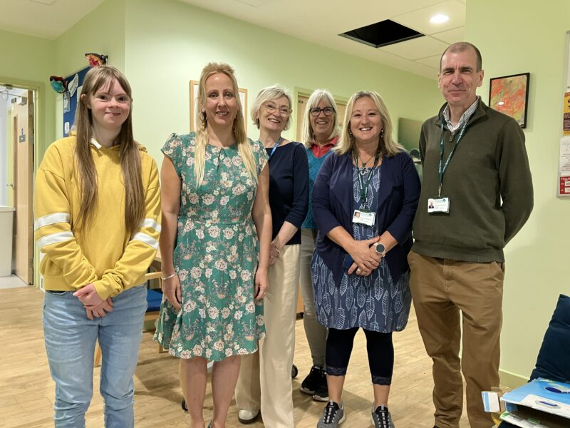 Becca and her mum with the teams from Dartmouth Caring and Reaching for Independence