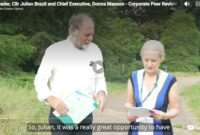 Councillor Julian Brazil, Leader of the council, and Donna Manson, Chief Executive of the Council, talking outside County Hall together about the very positive corporate peer review report