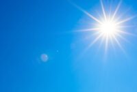 A bright sun in the blue sky