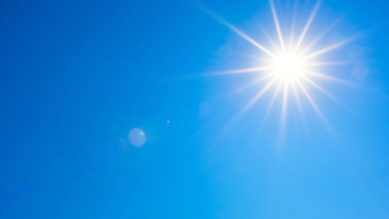 A bright sun in the blue sky