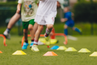 children learning football skills