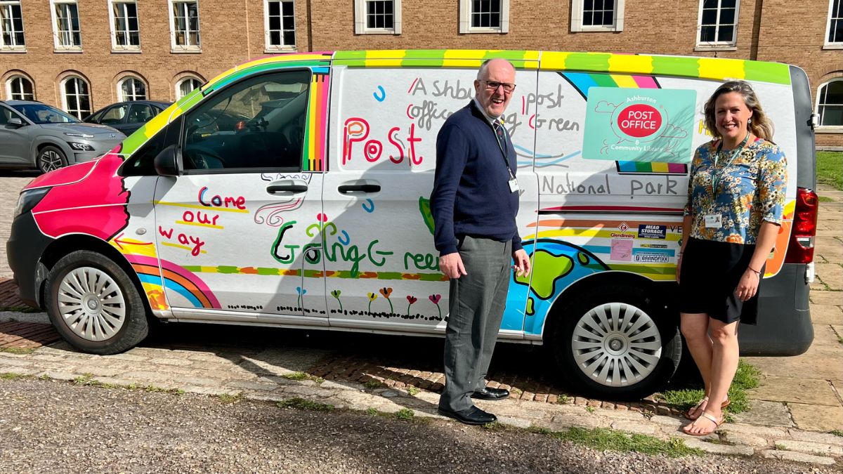Councillor Rogers and Councillor Cottle-Hunkin stood outside County Hall by a Post Office van