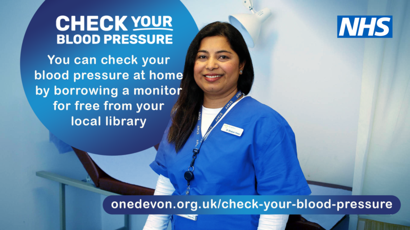 NHS promotional graphic showing a healthcare worker standing in a clinical setting. Text reads: “Check your blood pressure. You can check your blood pressure at home by borrowing a monitor for free from your local library.” Includes the One Devon website for more information.