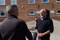 Councillor Julian Brazil, Leader of Devon County Council, being interviewed outside County Hall, Exeter