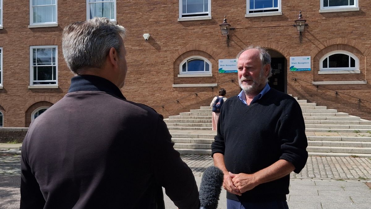 Councillor Julian Brazil, Leader of Devon County Council, being interviewed outside County Hall, Exeter