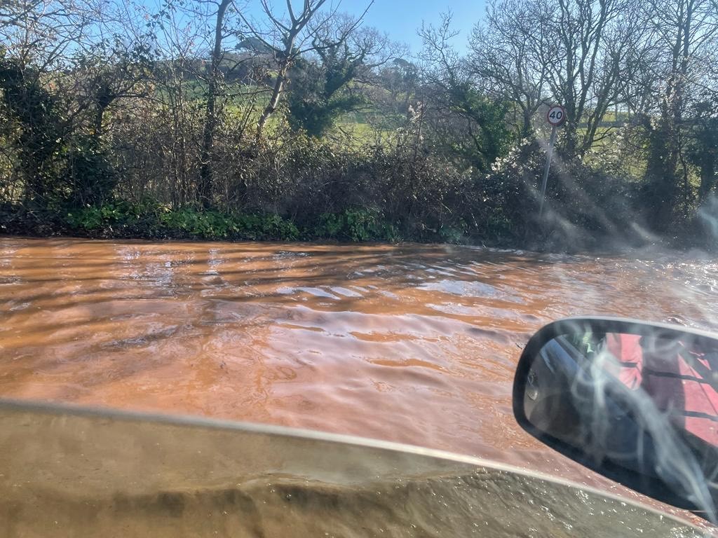 Archive photo of Devon Highways' A379 road flooded after storm